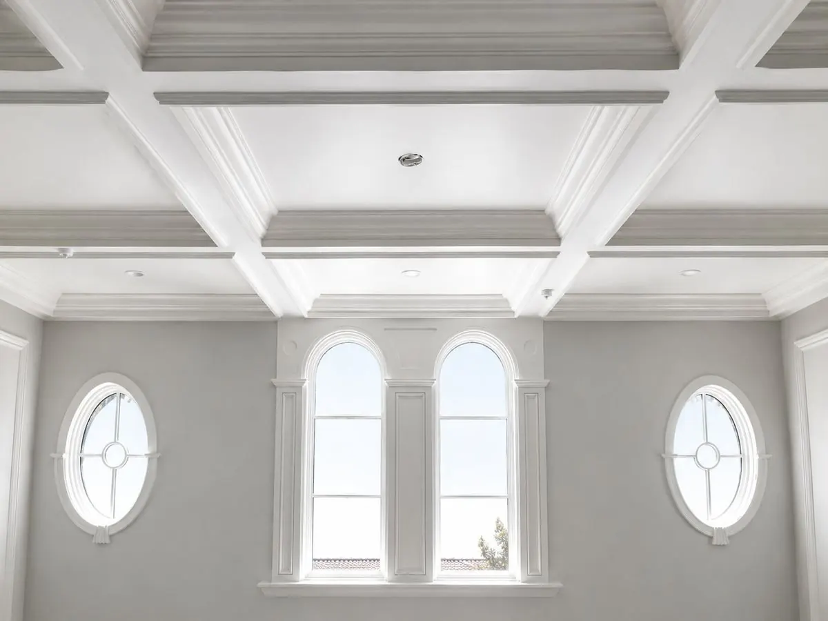 Completed coffered ceiling with crown detailing, arched and oval windows in San Juan Capistrano, CA by Serrano Construction